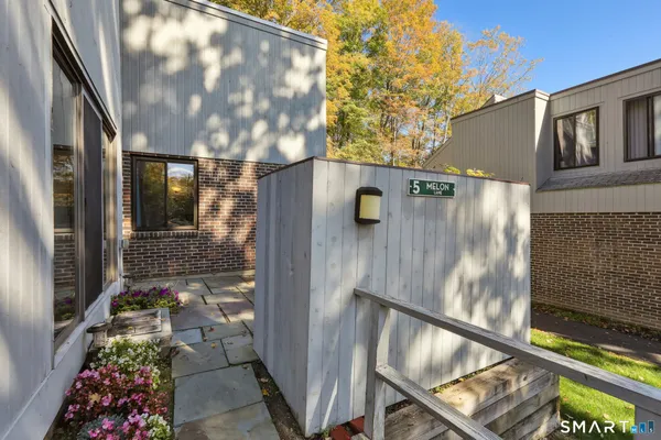 a backyard of a house with seating space