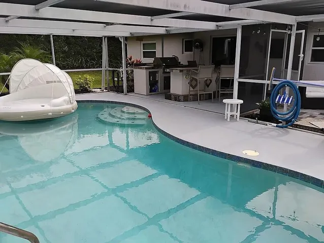 a view of a chairs and table in a patio