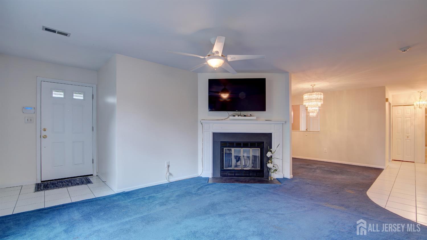 40 B Rutland Lane Monroe Township, NJ 08831 - Photo 11 of 31 a view of an empty room with a fireplace