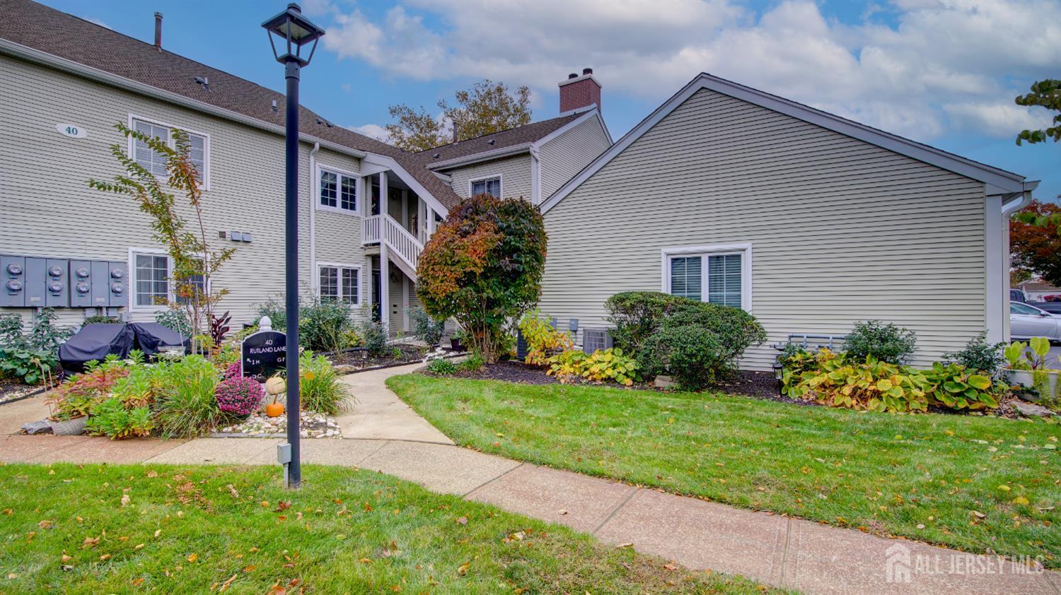 40 B Rutland Lane Monroe Township, NJ 08831 - Photo 21 of 31 a front view of a house with a yard
