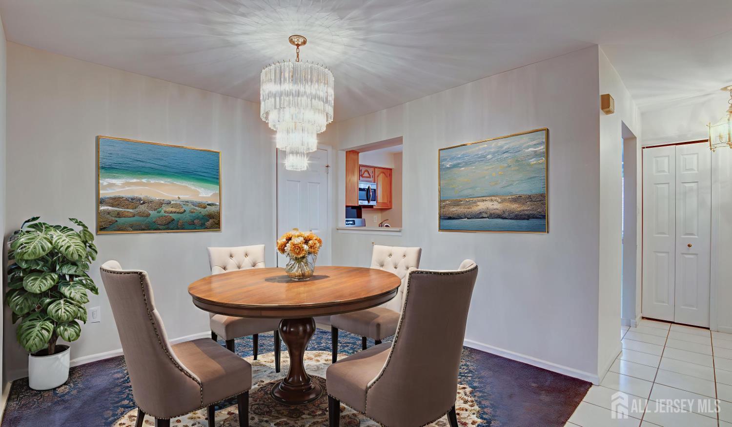 40 B Rutland Lane Monroe Township, NJ 08831 - Photo 29 of 31 a view of a dining room with furniture wooden floor and a chandelier
