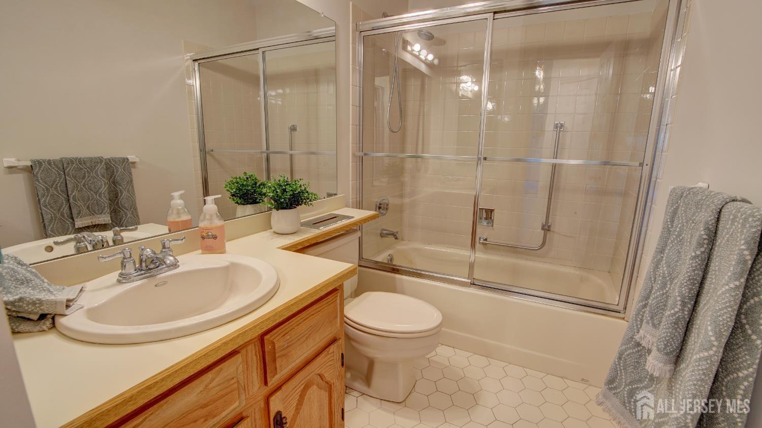 40 B Rutland Lane Monroe Township, NJ 08831 - Photo 7 of 31 a bathroom with a sink toilet and shower