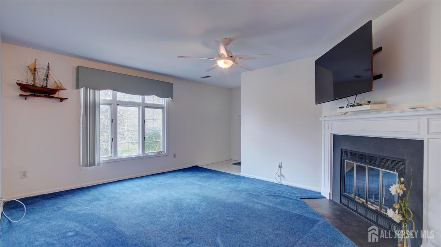40 B Rutland Lane Monroe Township, NJ 08831 - Photo 10 of 31 a view of empty room with a fireplace