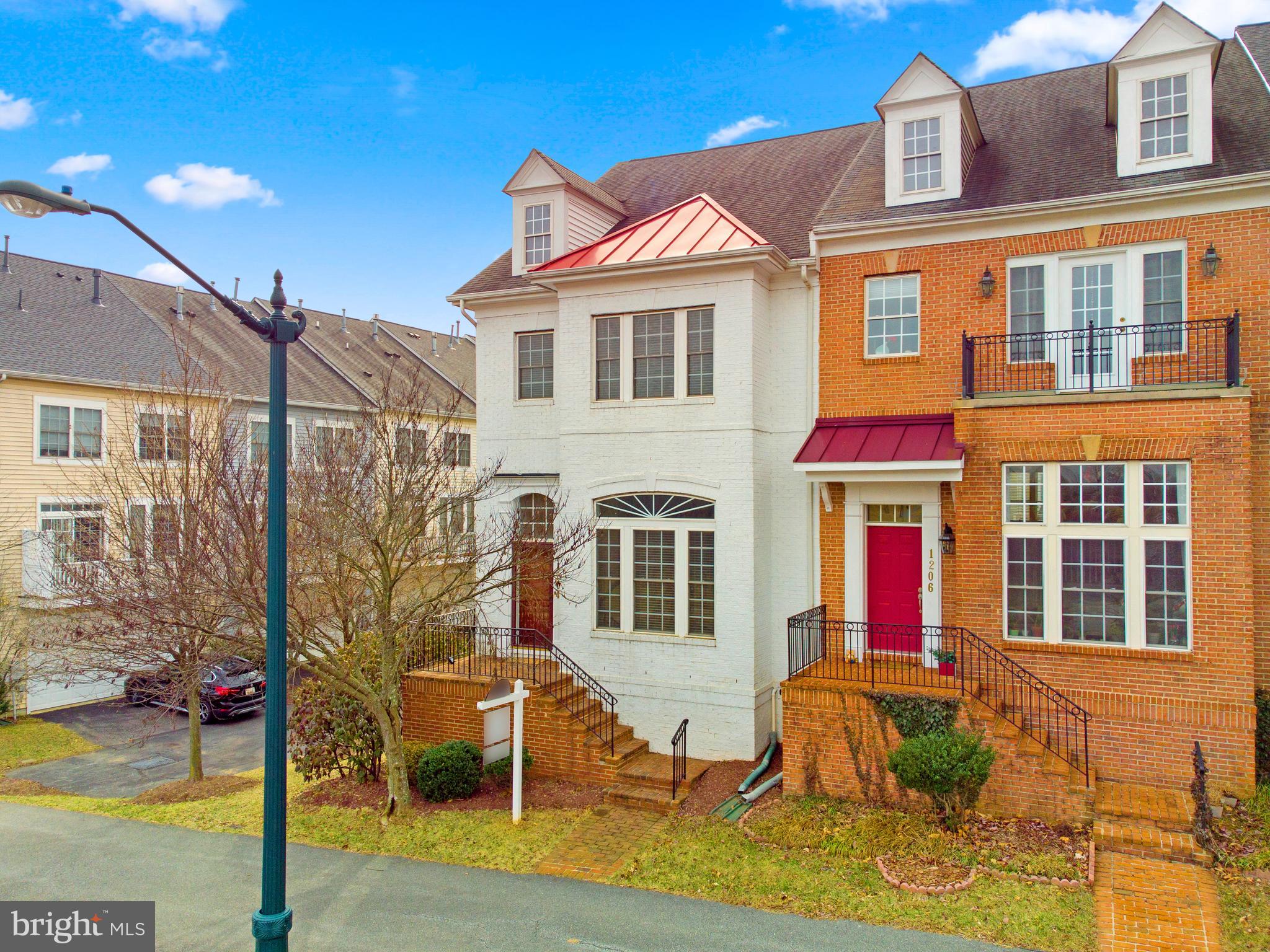 1204 Gaither Road Rockville, MD 20850 - Photo 1 of 50 a front view of a house with a porch