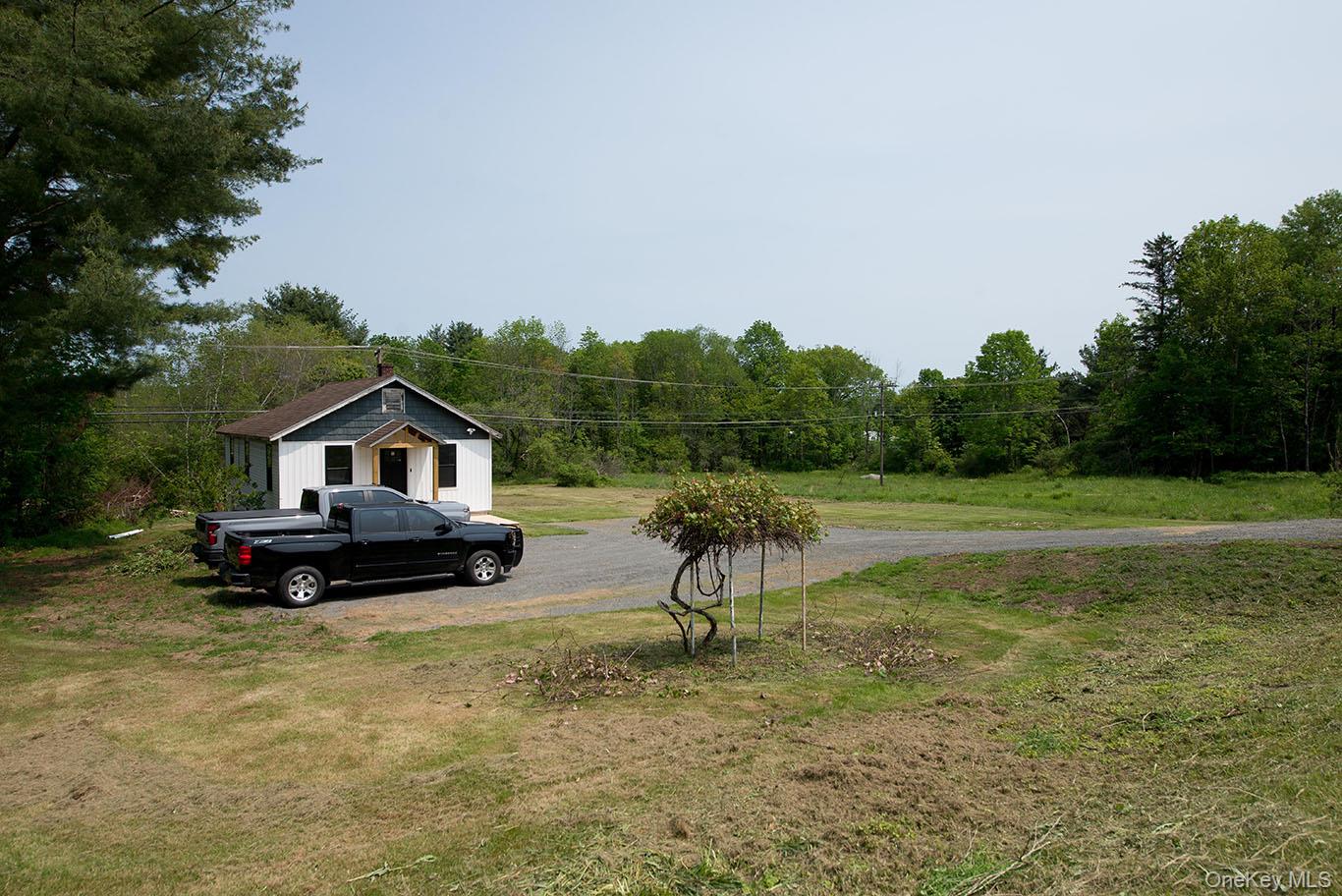 1132 Old Rte 17 Harris, NY 12742 - Photo 18 of 26 View of green lawn featuring view of wooded area
