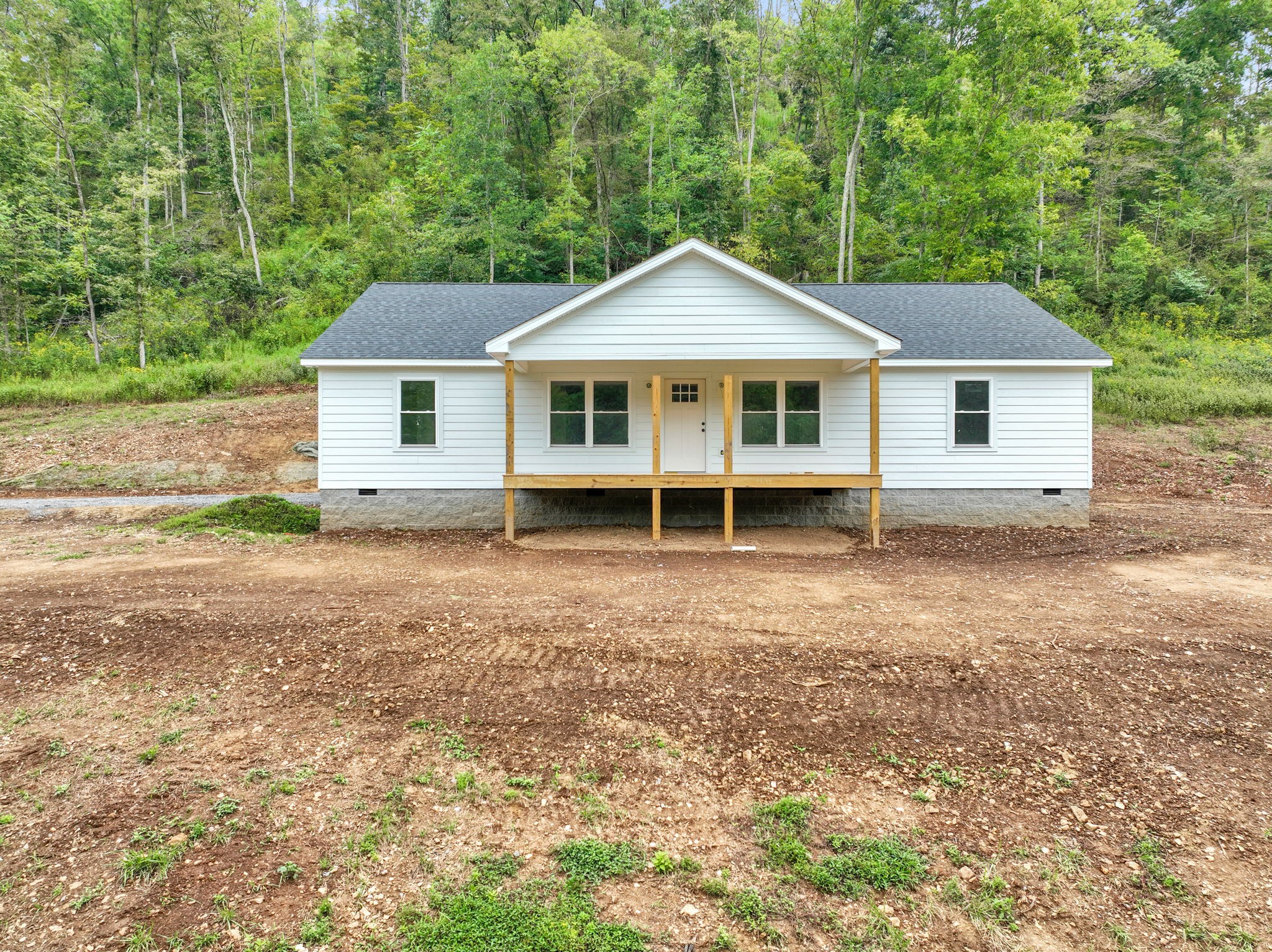 front view of a house with a yard