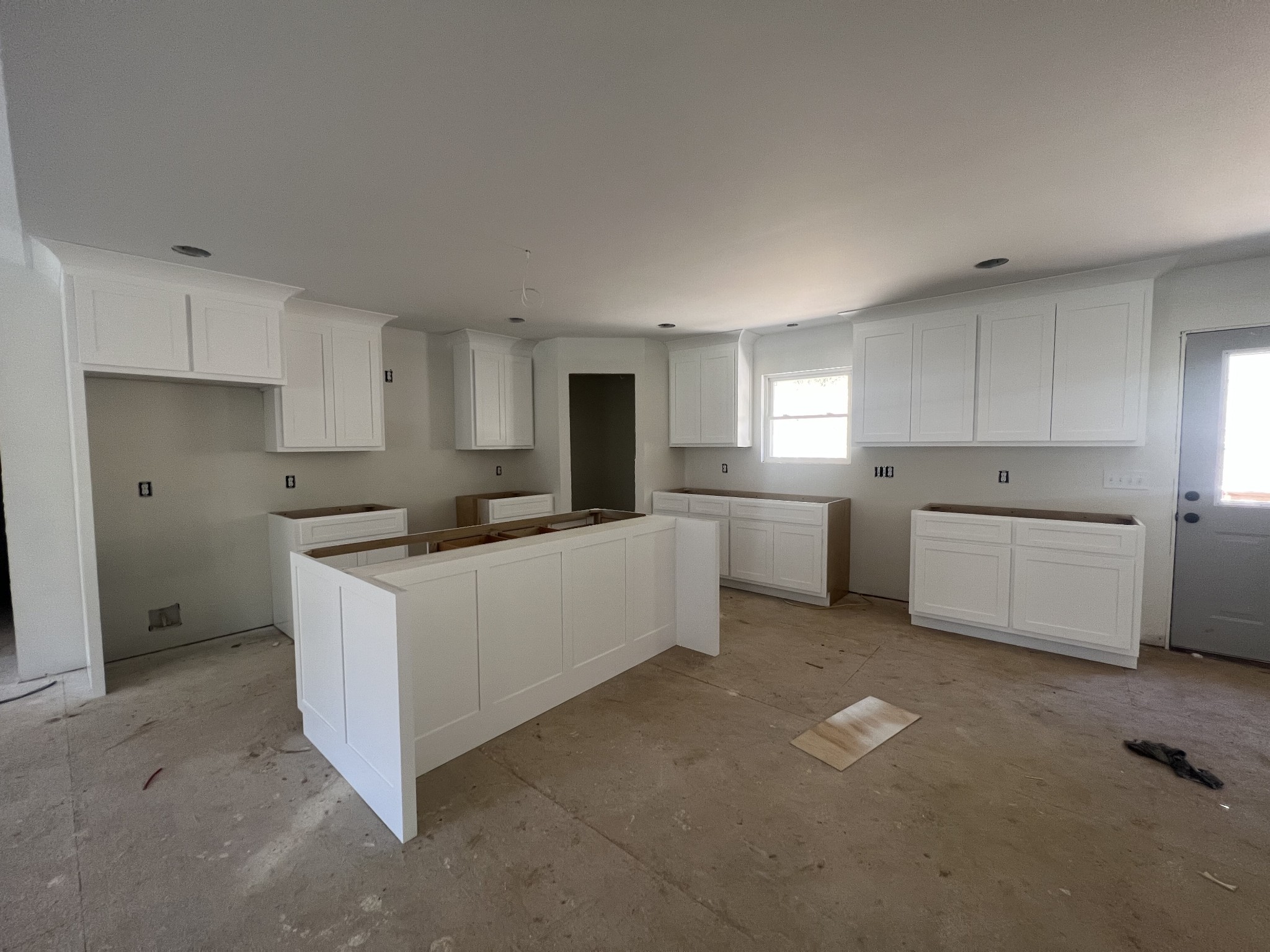 502 Difficult Road Pleasant Shade, TN 37145 - Photo 15 of 18 a kitchen with white cabinets and white appliances
