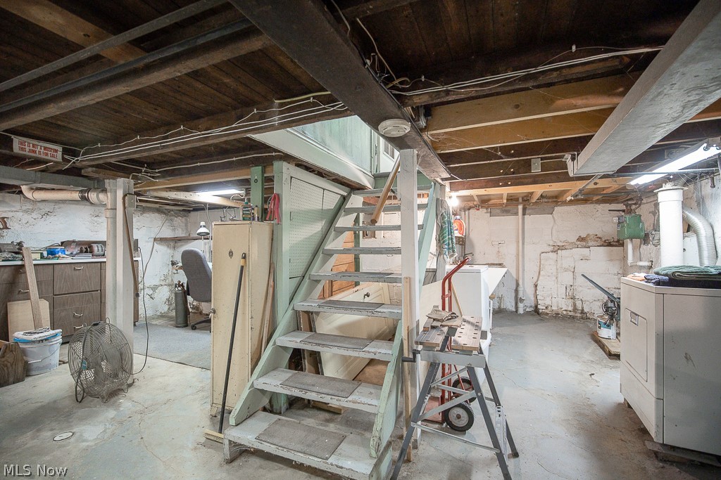 4541 Emerson Road Cleveland, OH 44121 - Photo 7 of 12 Basement with washer / dryer