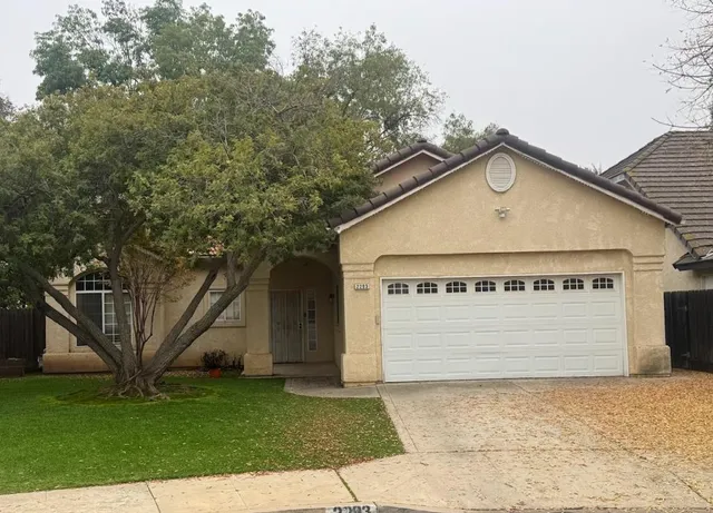 a large building with a tree in the background