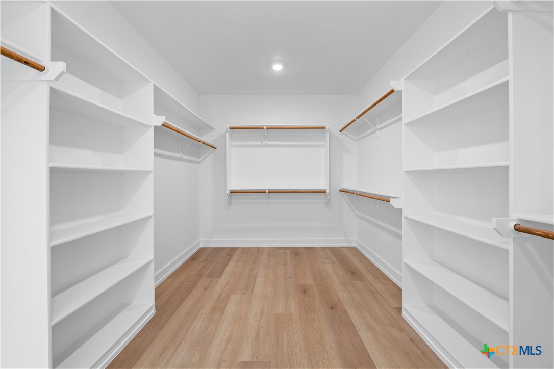 6830 Lacey Oak Road Salado, TX 76571 - Photo 26 of 34 a view of a room with wooden floor and floors