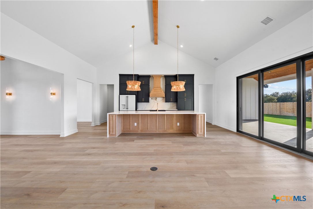 6830 Lacey Oak Road Salado, TX 76571 - Photo 3 of 34 a view of a kitchen with a sink and a large window