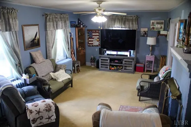 a living room with furniture and a flat screen tv