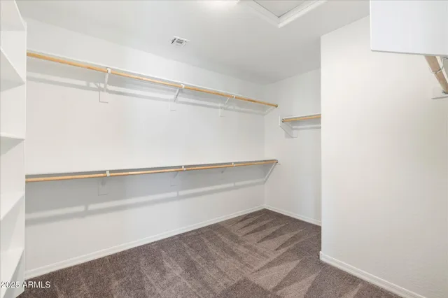 a view of an empty walk in closet