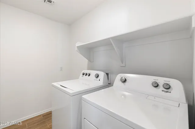 a utility room with dryer and washer
