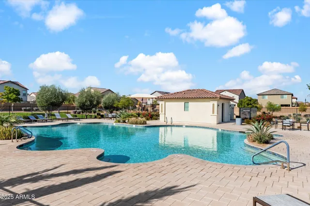 a view of a lake with a house in the background