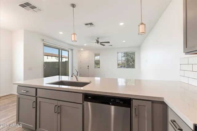 a kitchen with a sink and a refrigerator