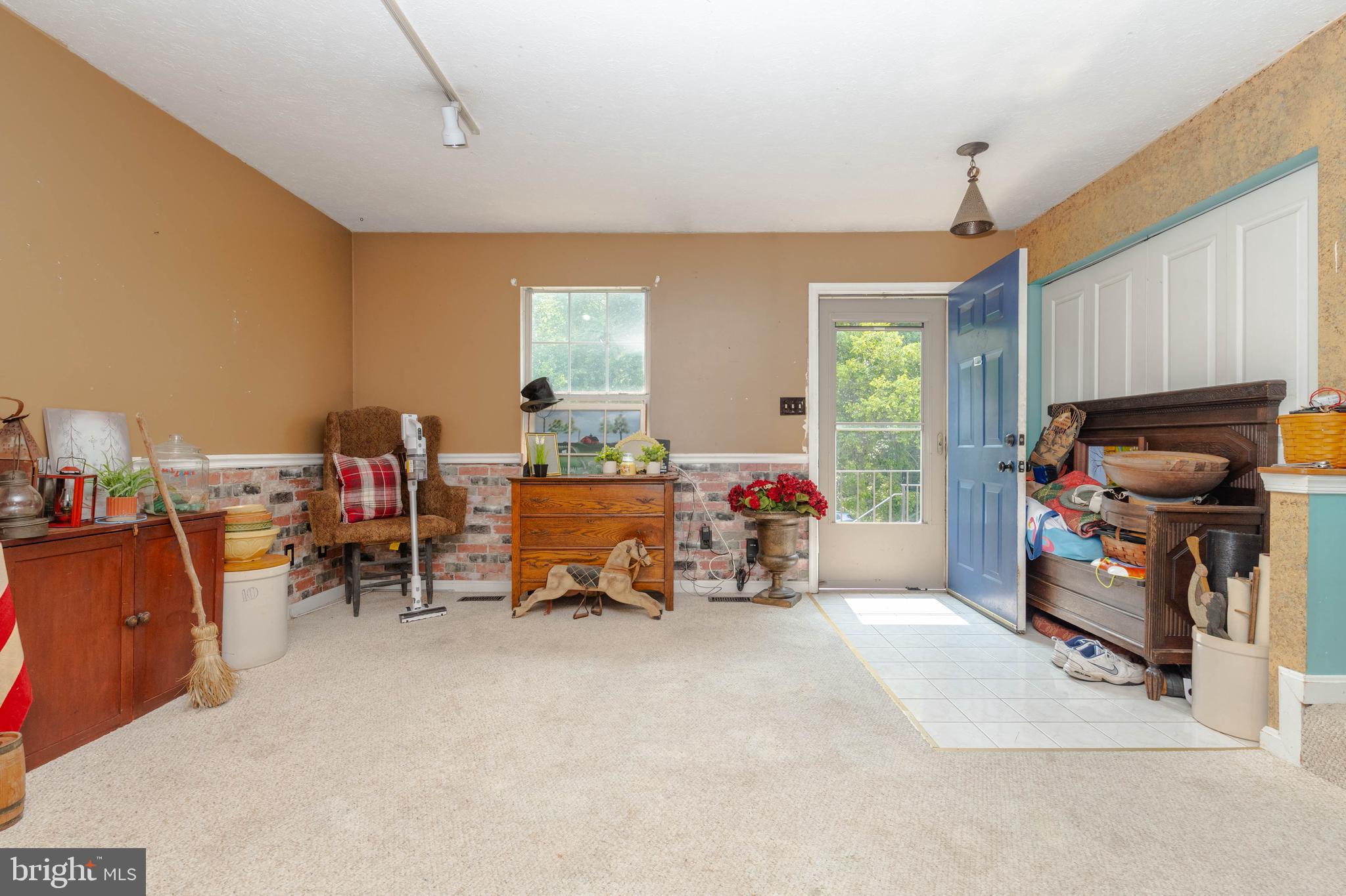 645 Nollmeyer Road Baltimore, MD 21220 - Photo 4 of 19 a bedroom with furniture and a gym equipment