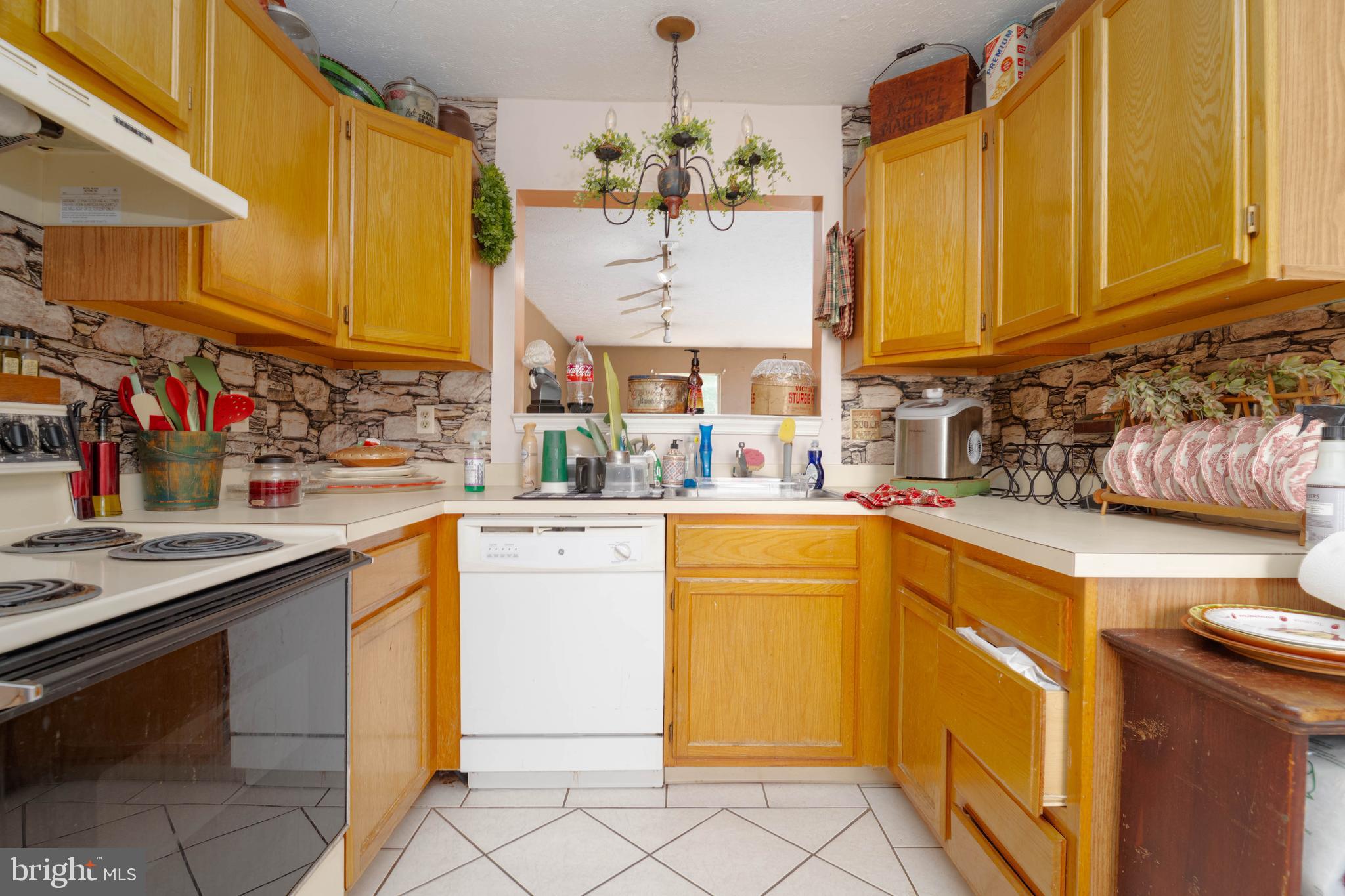 645 Nollmeyer Road Baltimore, MD 21220 - Photo 7 of 19 a kitchen with a sink and cabinets