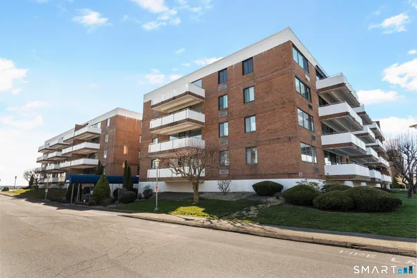 a front view of a building with street view