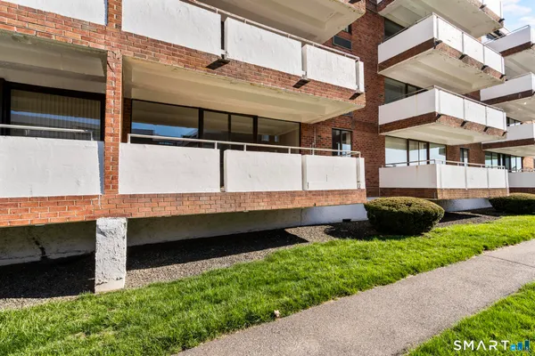 a front view of a house with a large window