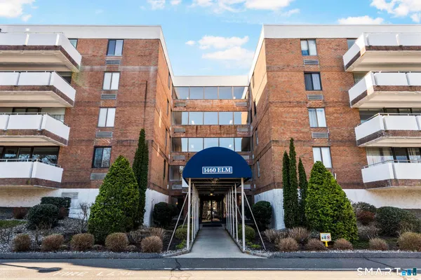 a front view of a building with garden