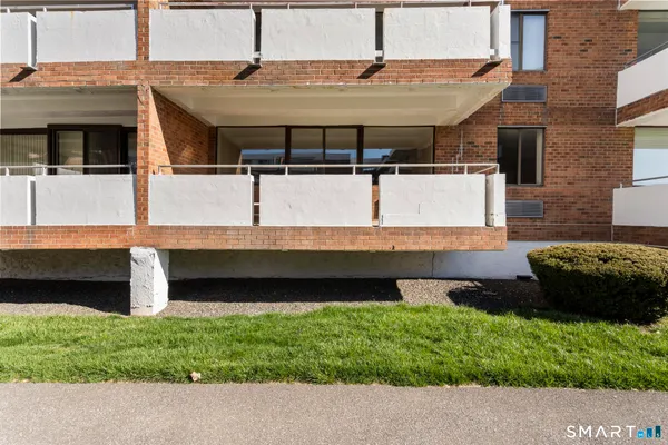 a view of a backyard with table and chairs
