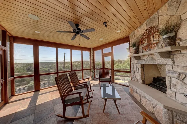 a view of a livingroom with furniture and a ceiling fan