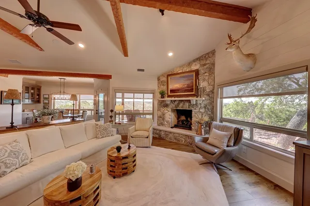 a living room with furniture fireplace and a flat screen tv