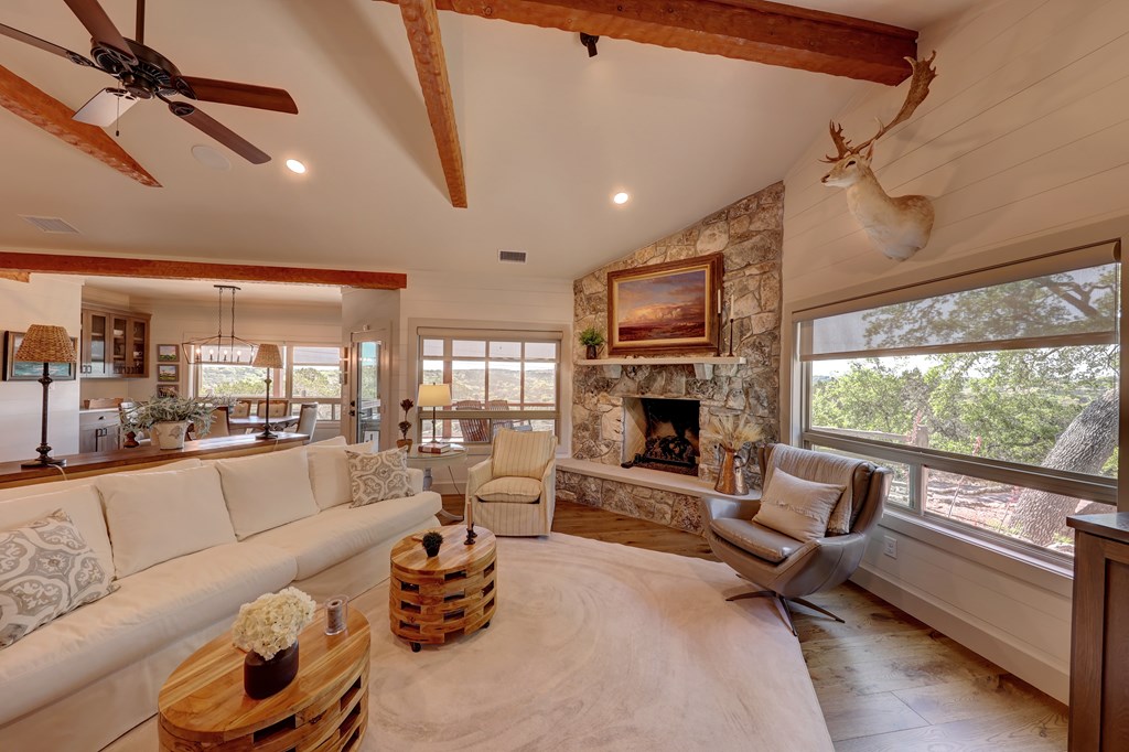 127 Keagan Drive Hunt, TX 78024 - Photo 7 of 12 a living room with furniture fireplace and a flat screen tv