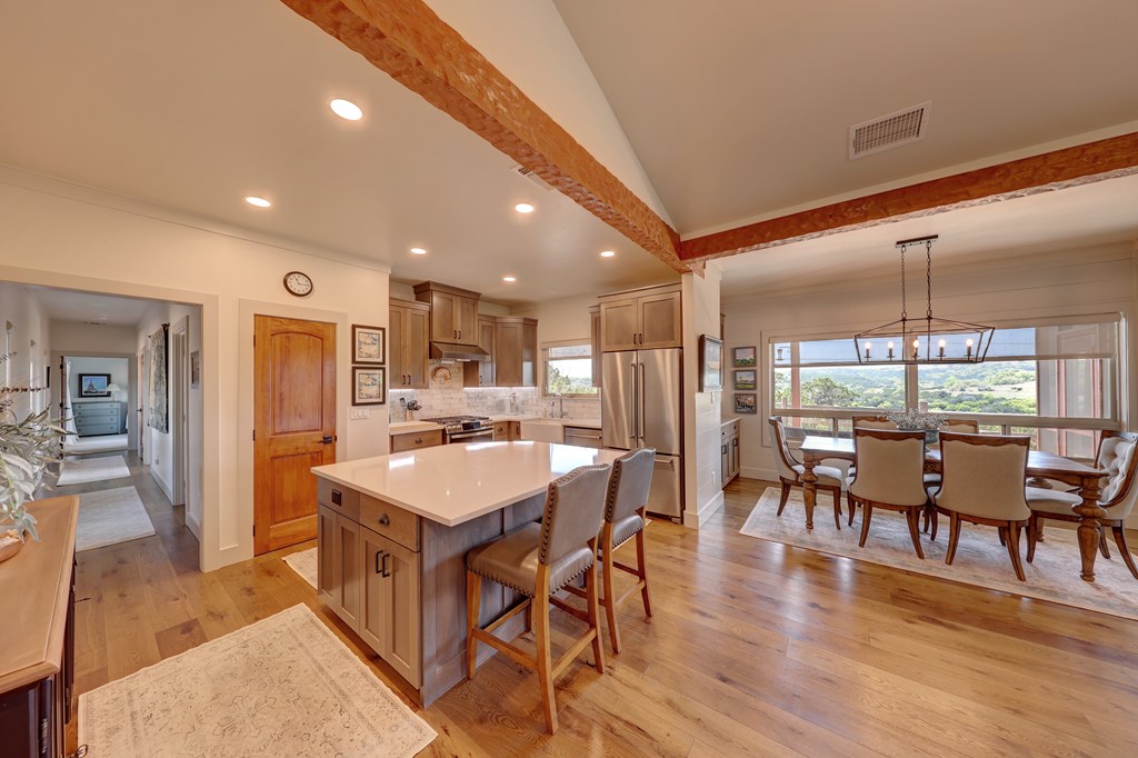 127 Keagan Drive Hunt, TX 78024 - Photo 9 of 12 a large kitchen with a table and chairs