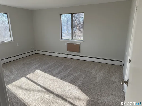 a view of a room that has a window in it