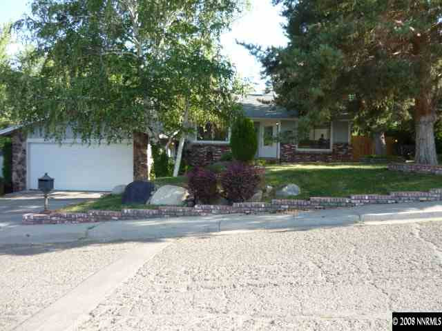 3180 Corey Drive Reno, NV 89509 - Photo 1 of 9 a view of a house with a yard and tree s
