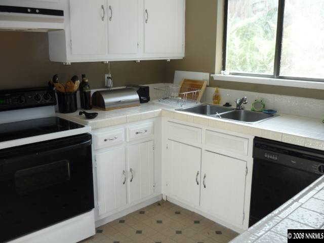 3180 Corey Drive Reno, NV 89509 - Photo 2 of 9 a kitchen with a sink and cabinets