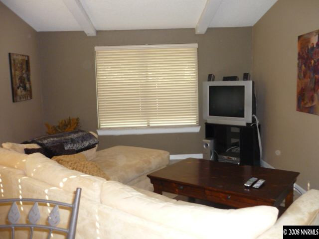 3180 Corey Drive Reno, NV 89509 - Photo 3 of 9 a bedroom with a bed window and television