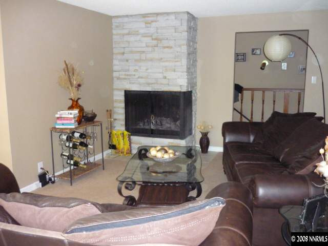 3180 Corey Drive Reno, NV 89509 - Photo 4 of 9 a living room with furniture and a fireplace