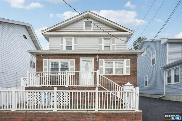 a front view of a house with a porch