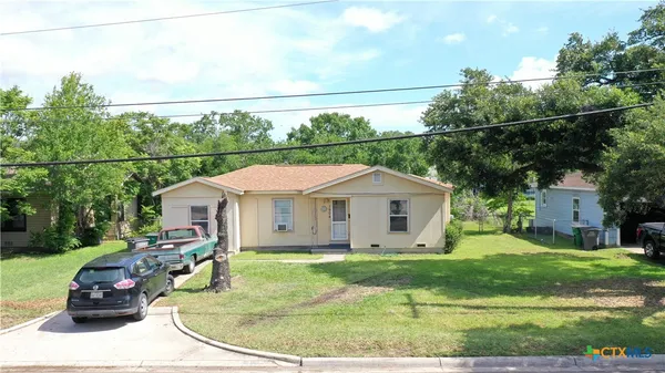 a view of a house with a sink and yard