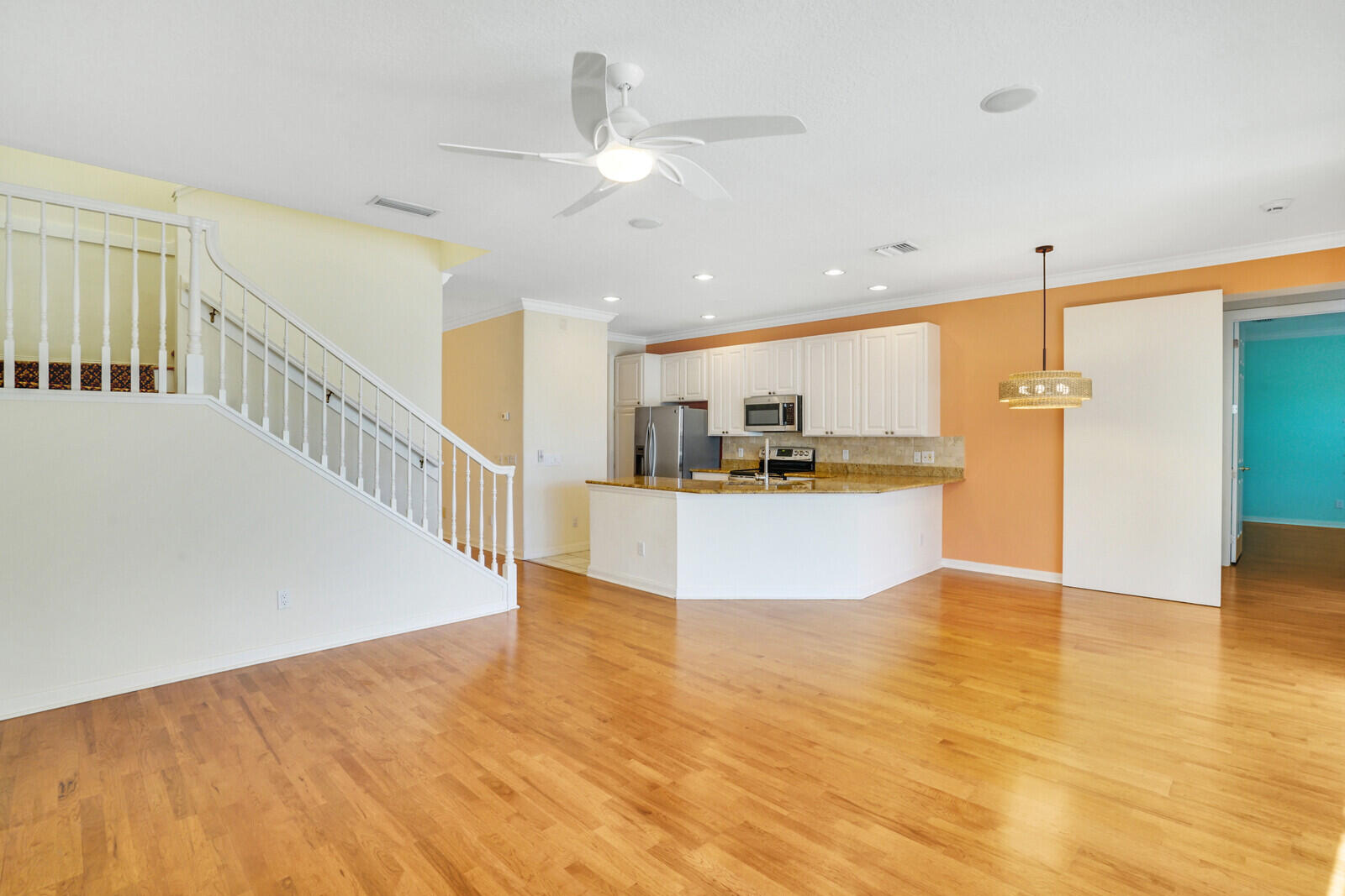 142 Barbados Drive Jupiter, FL 33458 - Photo 11 of 53 a view of kitchen with kitchen island microwave and stove