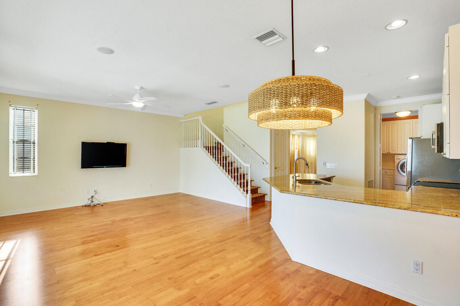 142 Barbados Drive Jupiter, FL 33458 - Photo 12 of 53 a living room with a flat screen tv and a table