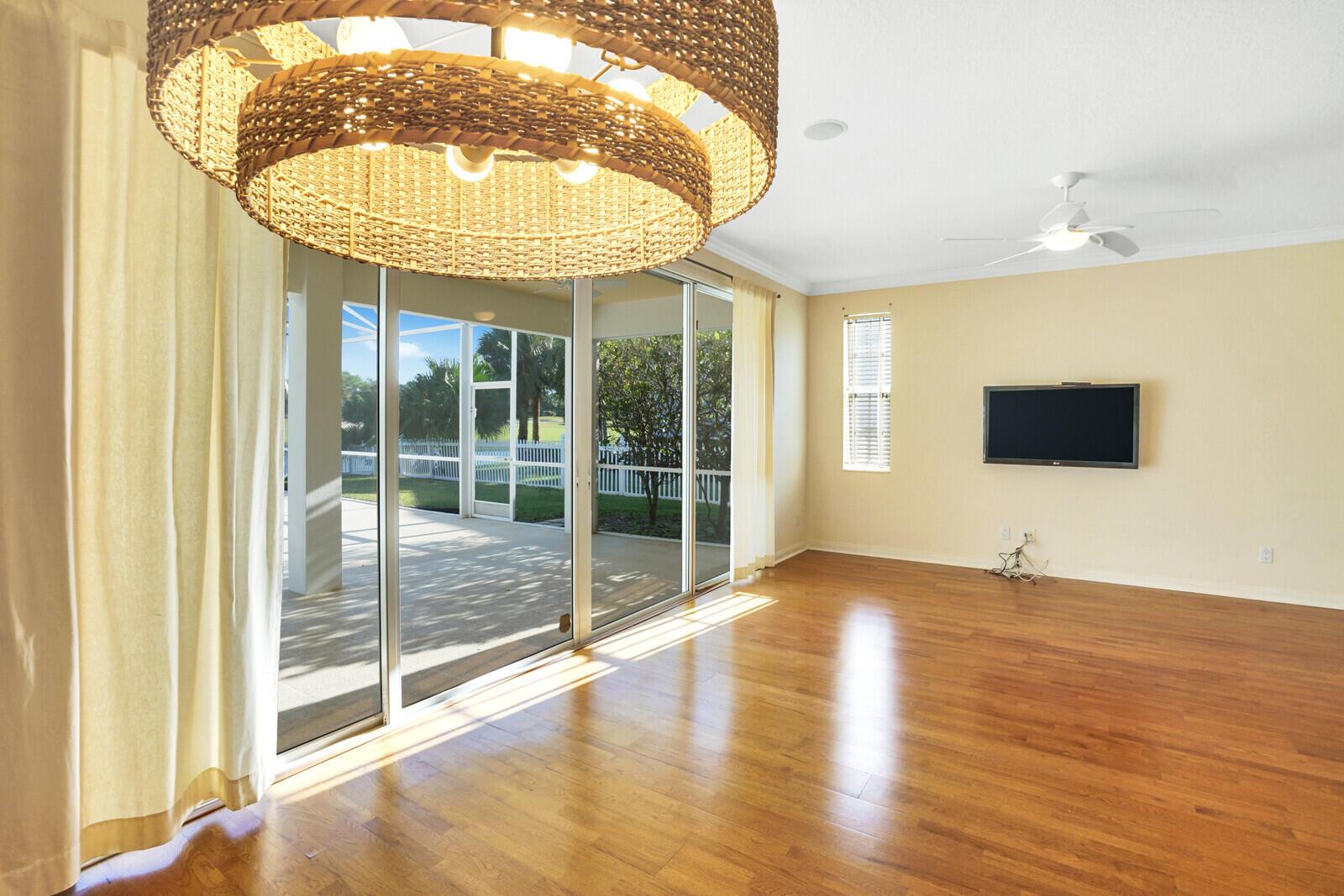 142 Barbados Drive Jupiter, FL 33458 - Photo 13 of 53 a view of an empty room with a window and wooden floor