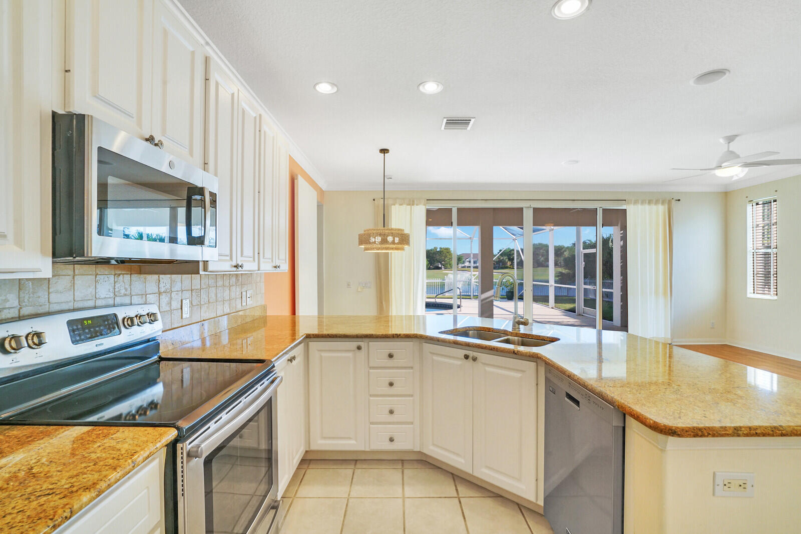 142 Barbados Drive Jupiter, FL 33458 - Photo 17 of 53 a kitchen that has a sink and cabinets