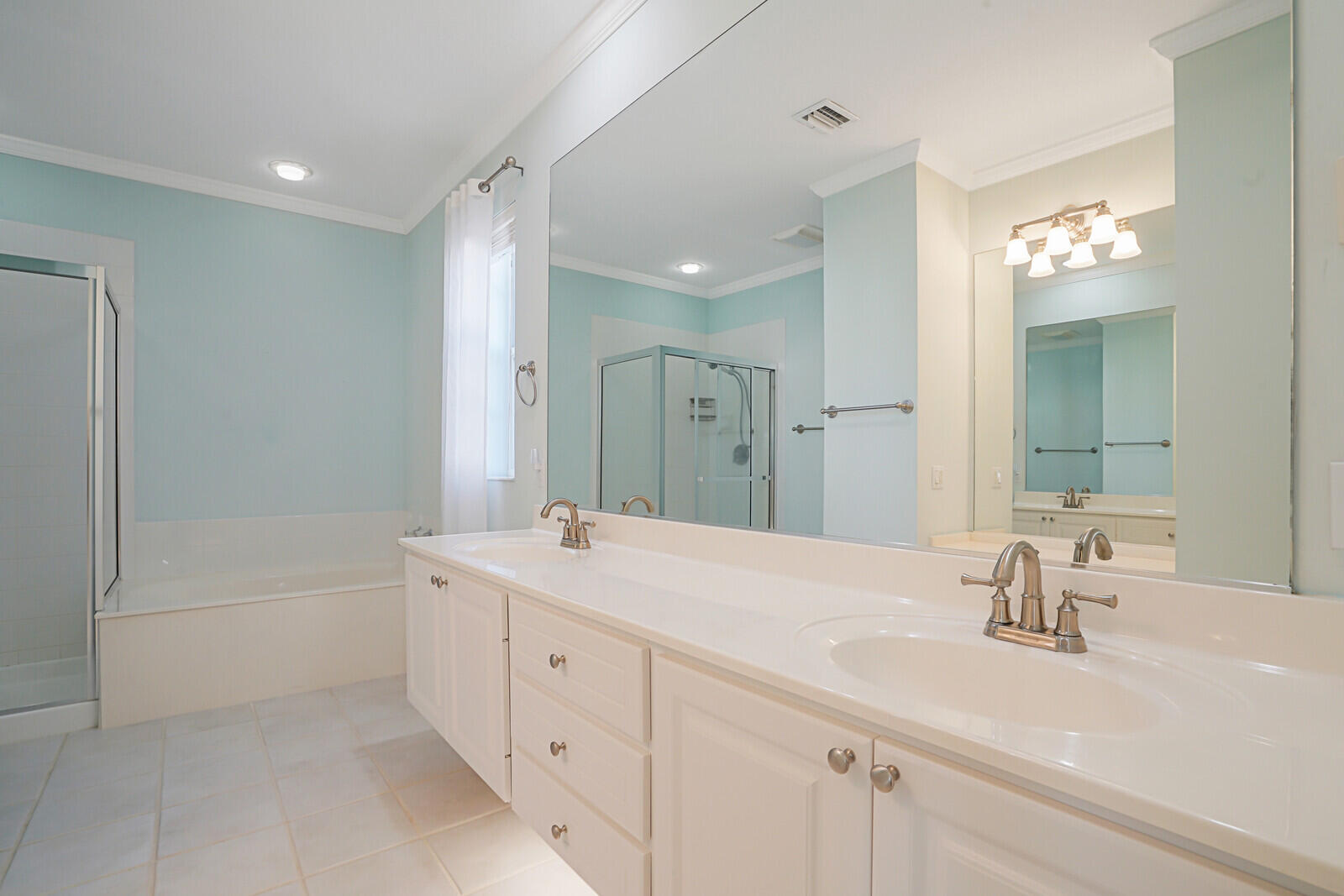 142 Barbados Drive Jupiter, FL 33458 - Photo 21 of 53 a bathroom with a sink double vanity granite tub shower and a mirror