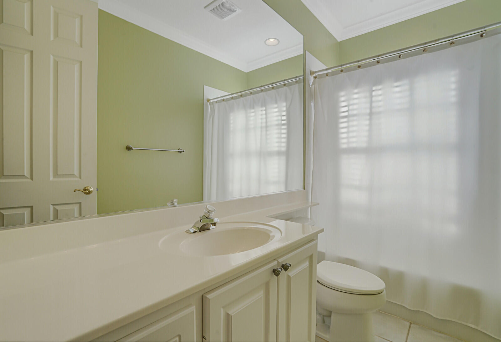 142 Barbados Drive Jupiter, FL 33458 - Photo 28 of 53 a bathroom with a sink and a mirror
