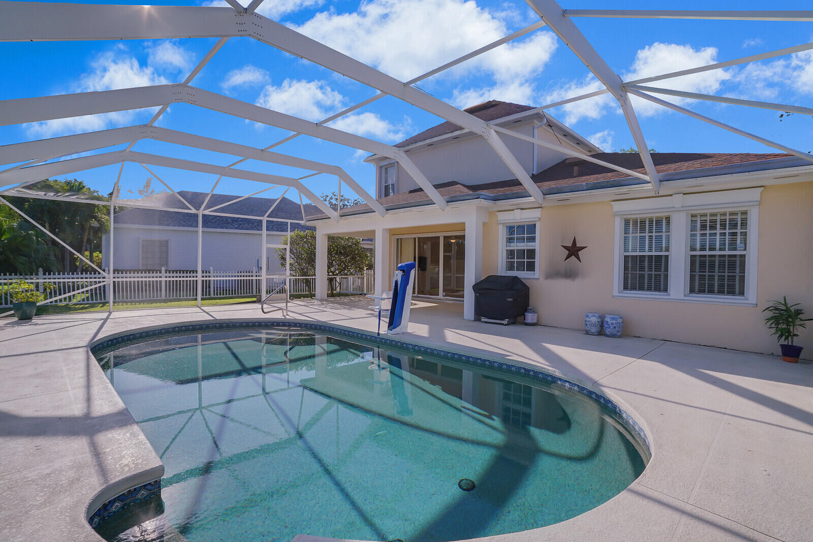 142 Barbados Drive Jupiter, FL 33458 - Photo 31 of 53 a view of a backyard with seating space and furniture in front of it