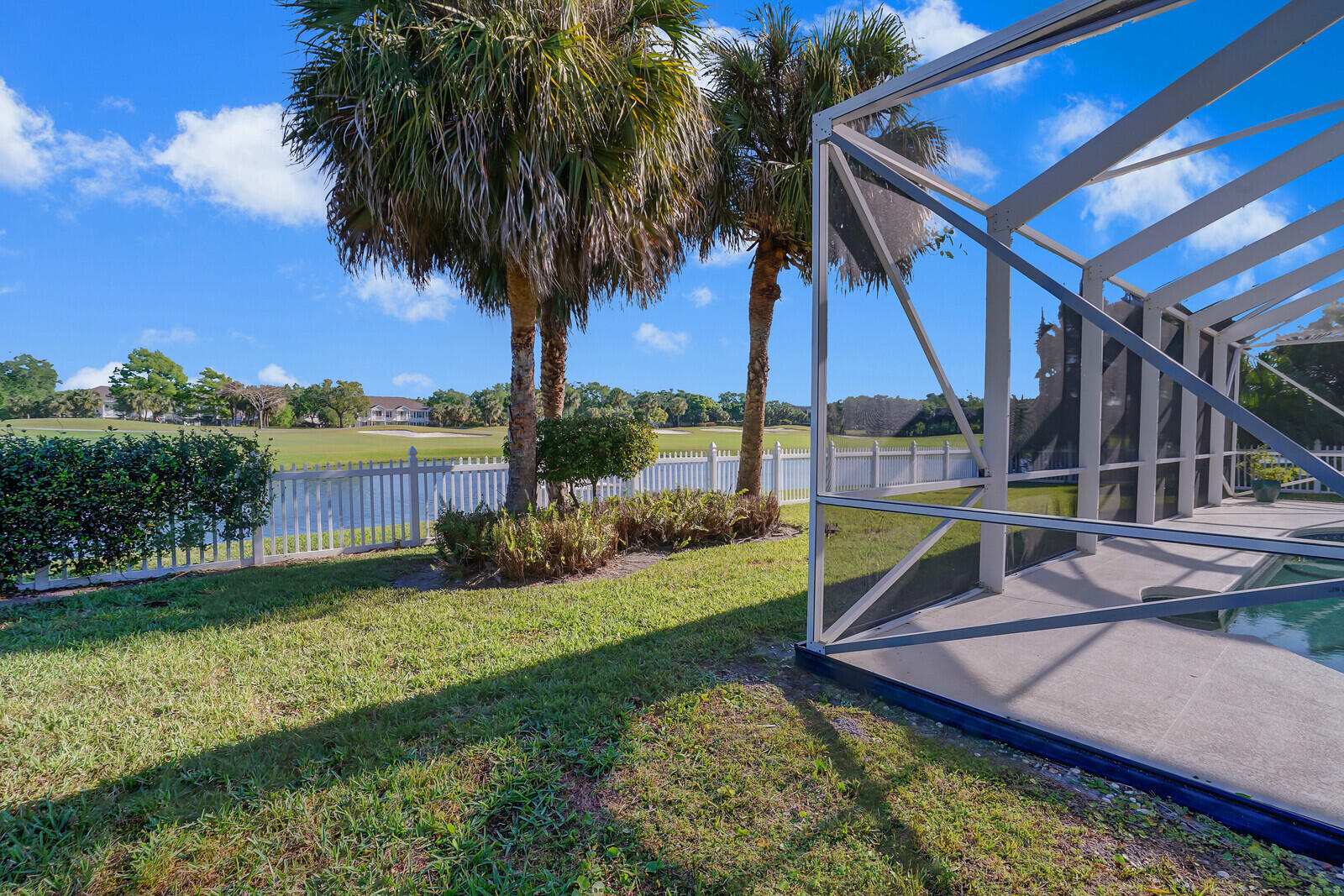 142 Barbados Drive Jupiter, FL 33458 - Photo 37 of 53 a view of a backyard with swimming pool