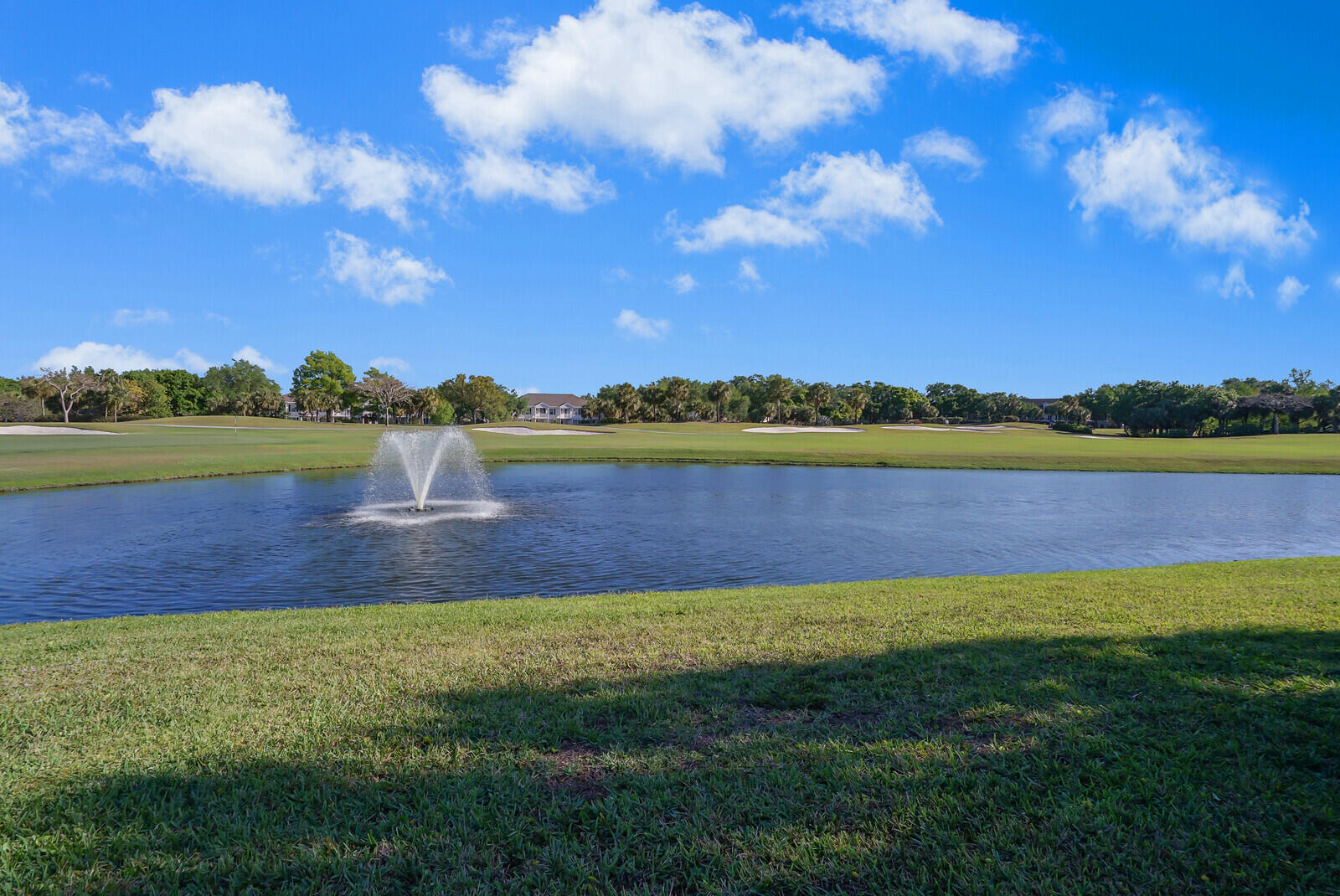 142 Barbados Drive Jupiter, FL 33458 - Photo 40 of 53 a view of a lake with houses in the back