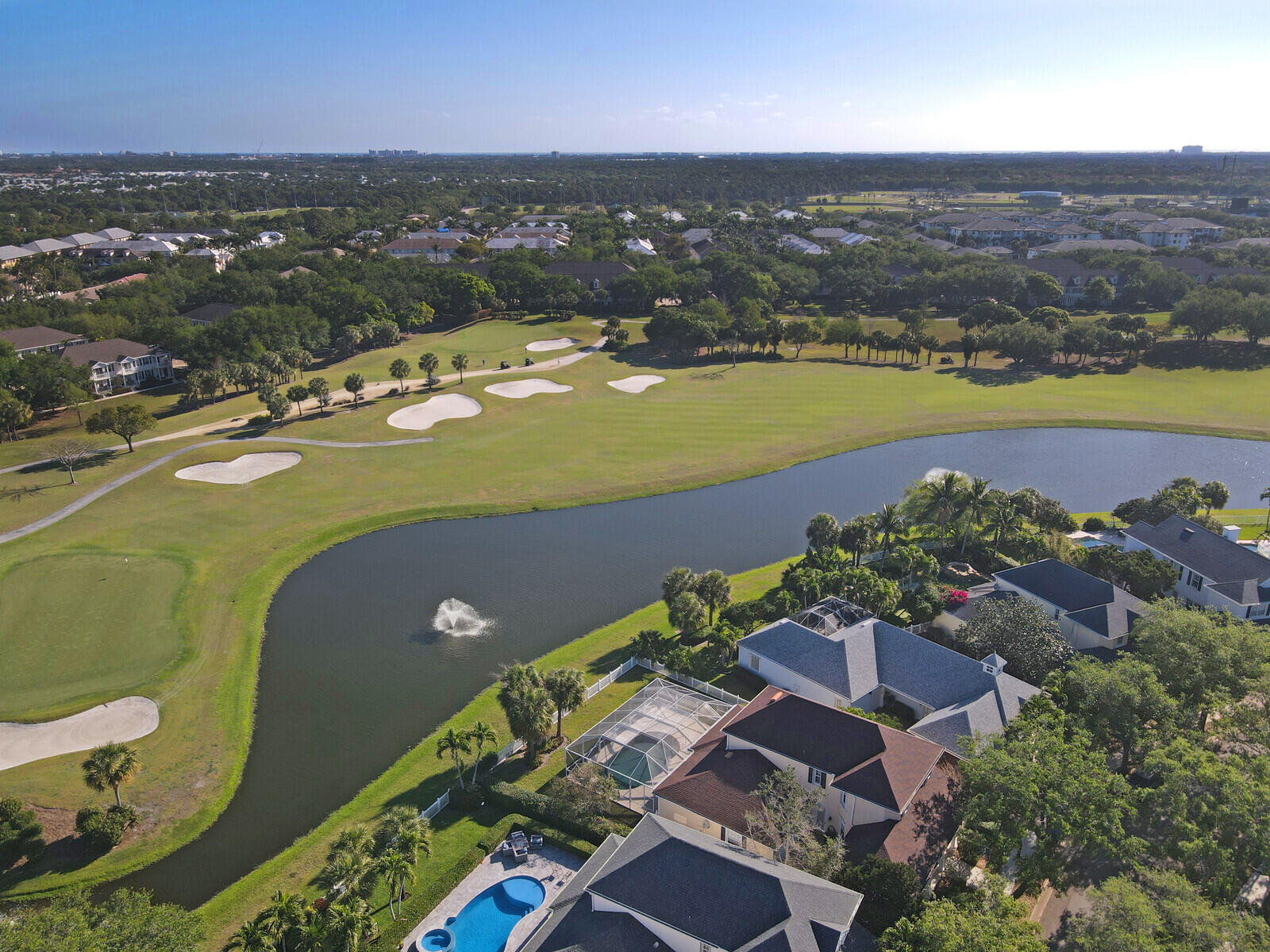 142 Barbados Drive Jupiter, FL 33458 - Photo 46 of 53 an aerial view of a houses with a lake view