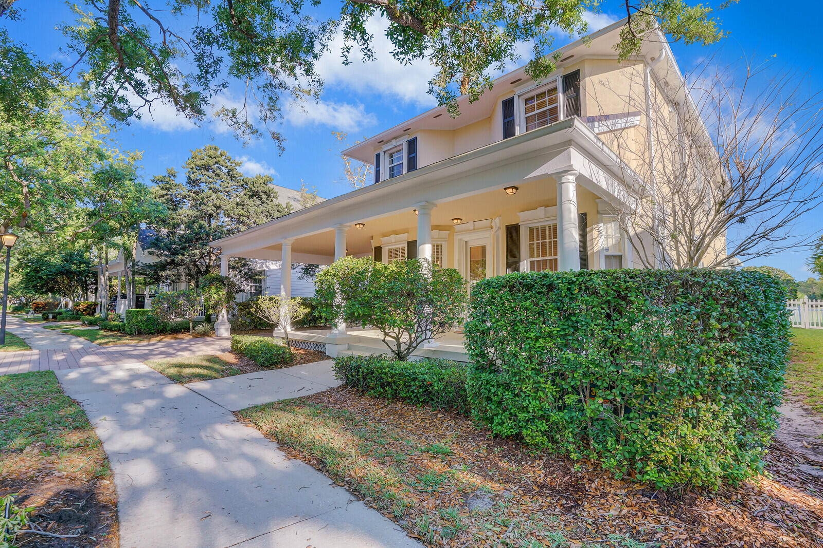 142 Barbados Drive Jupiter, FL 33458 - Photo 50 of 53 a front view of a house with garden