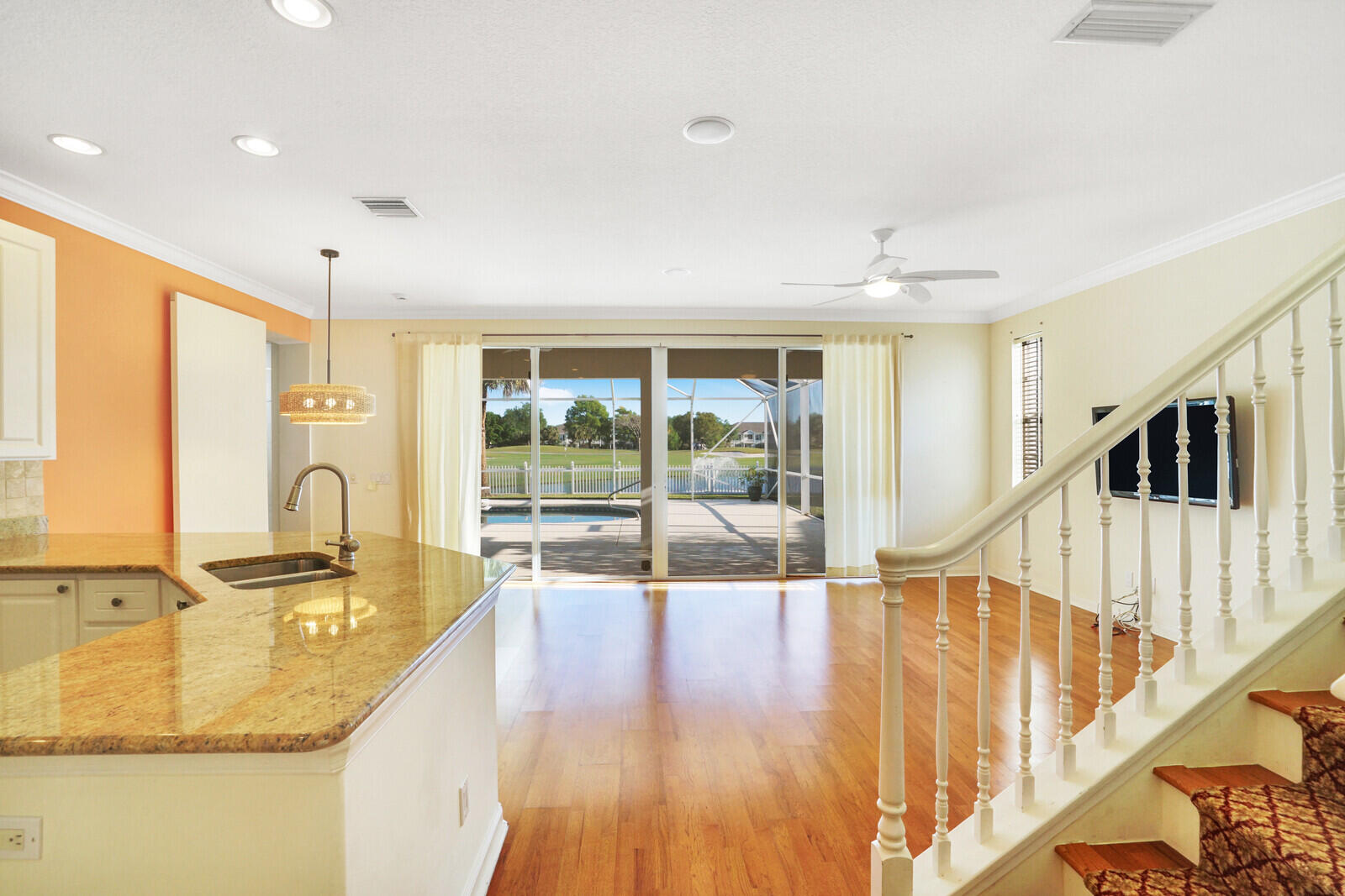 142 Barbados Drive Jupiter, FL 33458 - Photo 9 of 53 a view of a kitchen with kitchen island a large window and sink