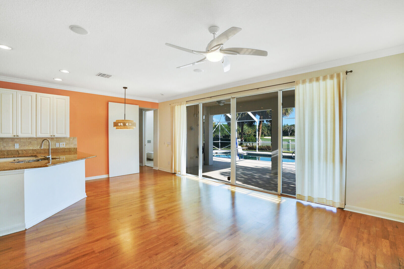 142 Barbados Drive Jupiter, FL 33458 - Photo 10 of 53 a view of an entryway with wooden floor and windows